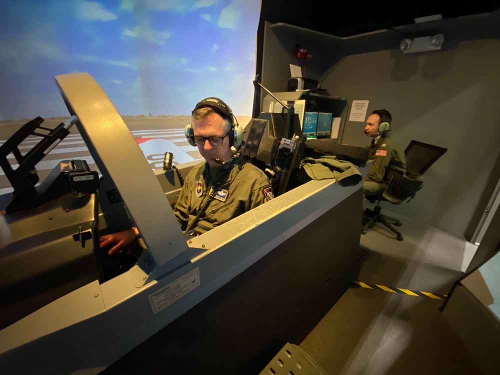 Air Force Maj. Gen. Craig D. Wills, Commander, 19th Air Force, experiences simulator