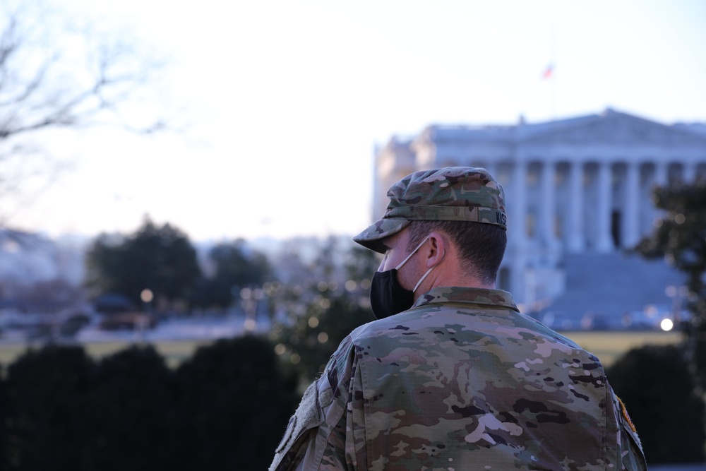 A Soldier with the Virginia National Guard stands near the Capitol building.