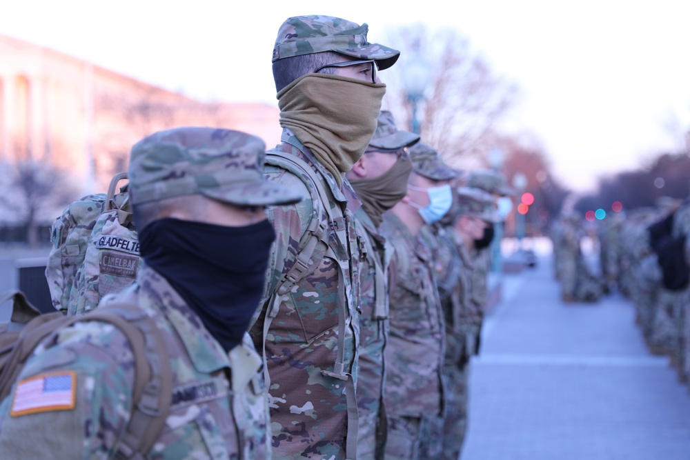 U.S. Soldiers with the New Jersey National Guard stand in formation before beginning their guard shift.