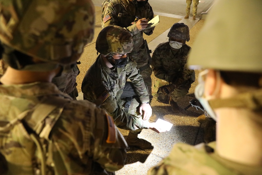 U.S. Army Sgt. Aidan Curran briefs New Jersey National Guard medics on casualty evacuation procedures.