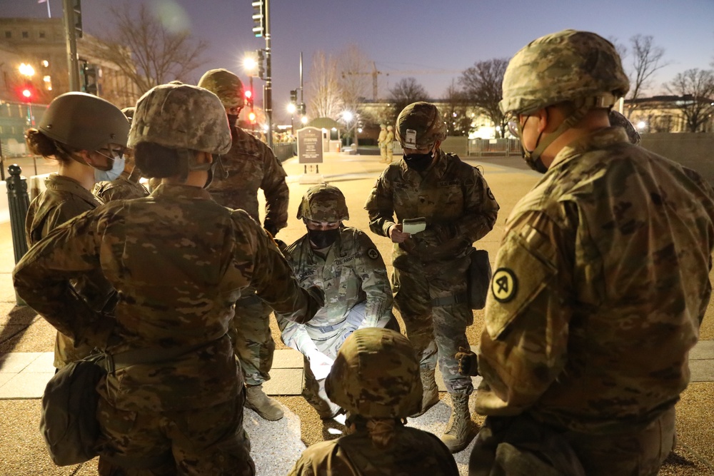 New Jersey National Guard medics getting briefed on casualty evacuation procedures.