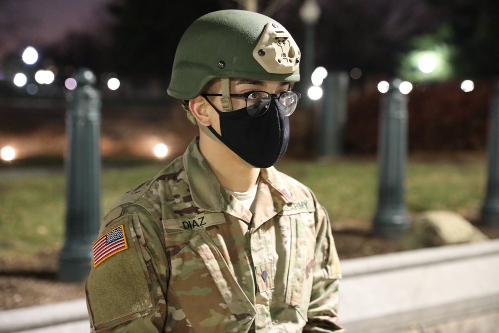 U.S. Army Spc. Berny Diaz with the New Jersey National Guard stands near the Capitol building.