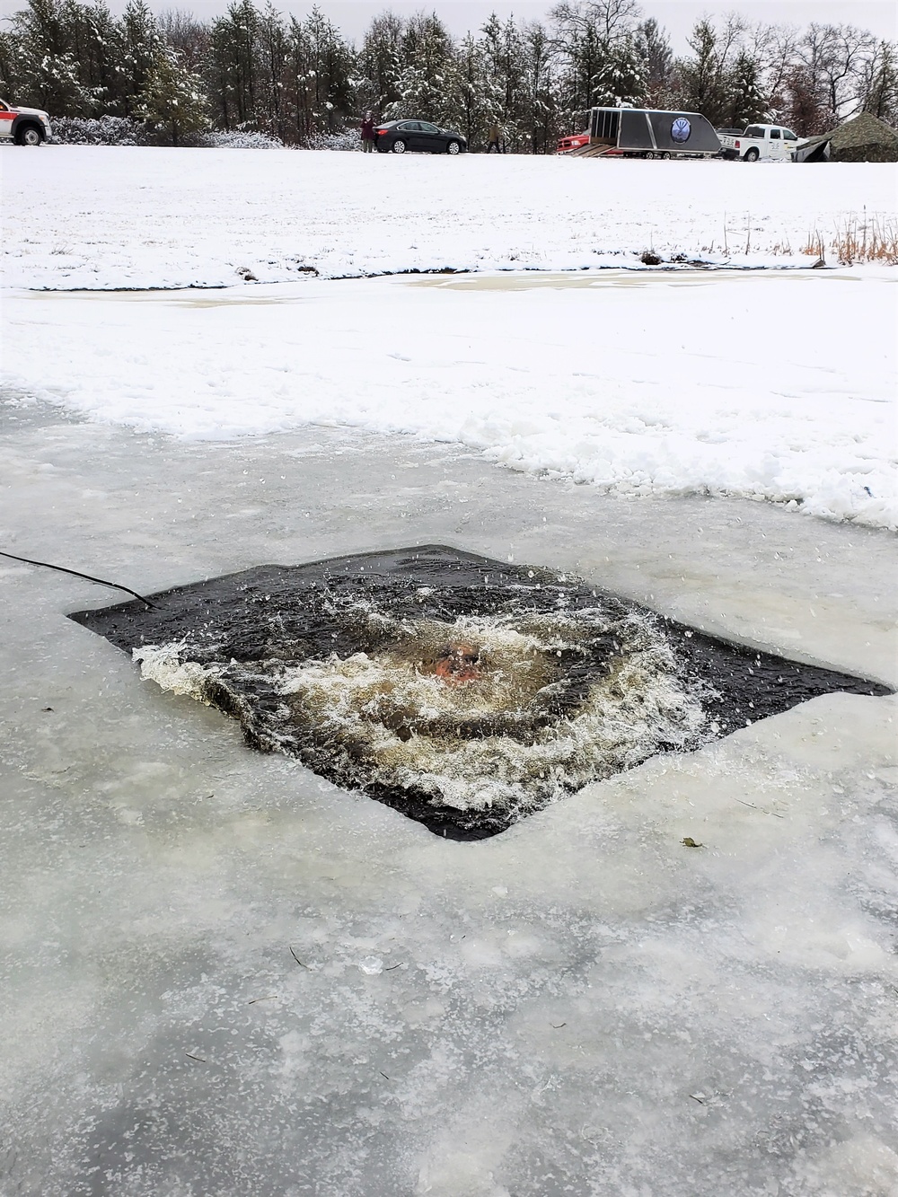 Fort McCoy garrison commander takes plunge during cold-water immersion familiarization