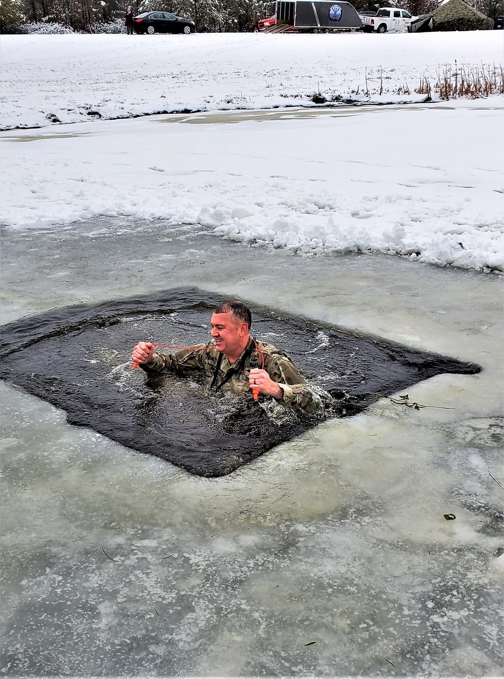 Fort McCoy garrison commander takes plunge during cold-water immersion familiarization
