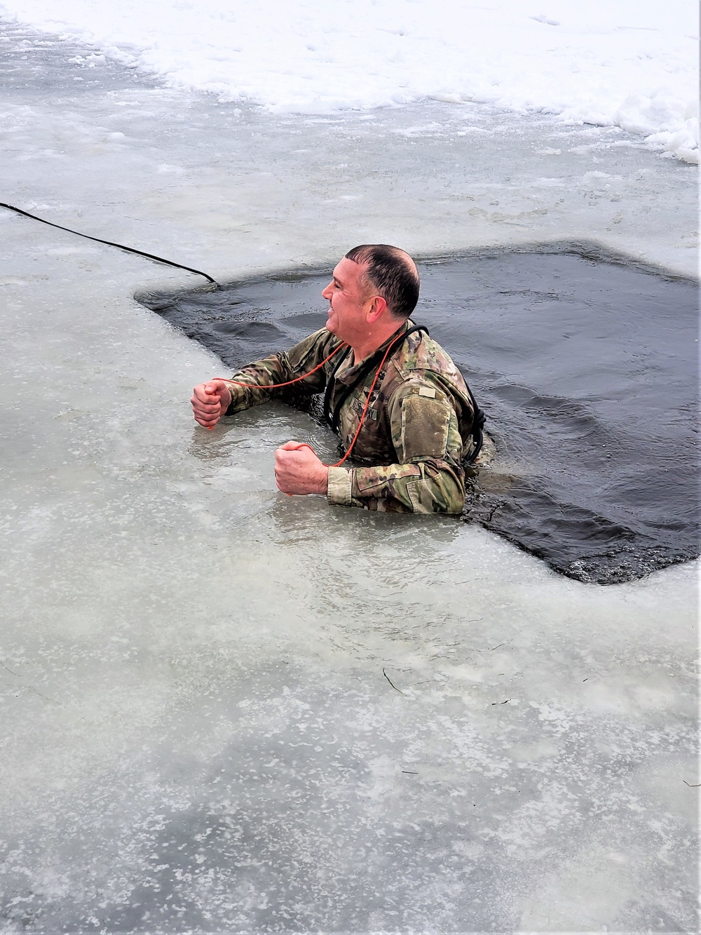 Fort McCoy garrison commander takes plunge during cold-water immersion familiarization