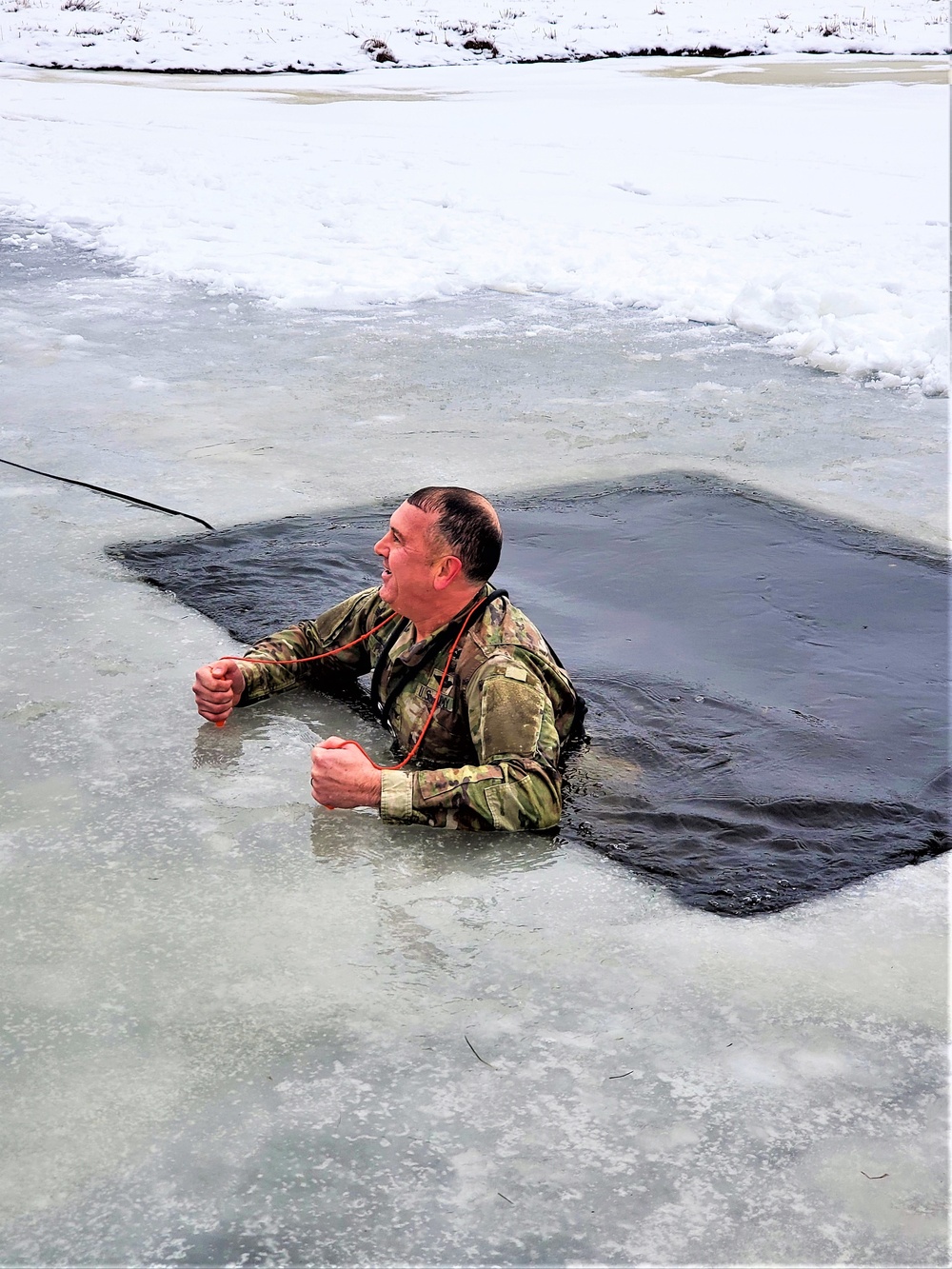 Fort McCoy garrison commander takes plunge during cold-water immersion familiarization