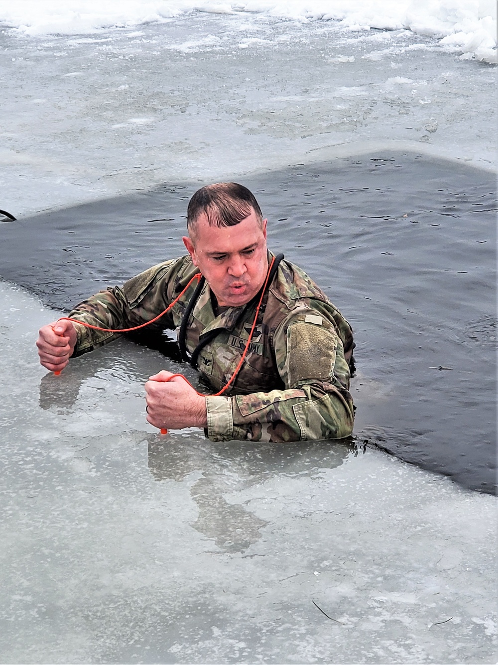 Fort McCoy garrison commander takes plunge during cold-water immersion familiarization