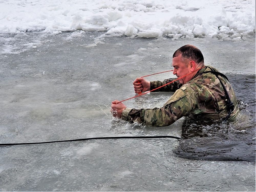 Fort McCoy garrison commander takes plunge during cold-water immersion familiarization