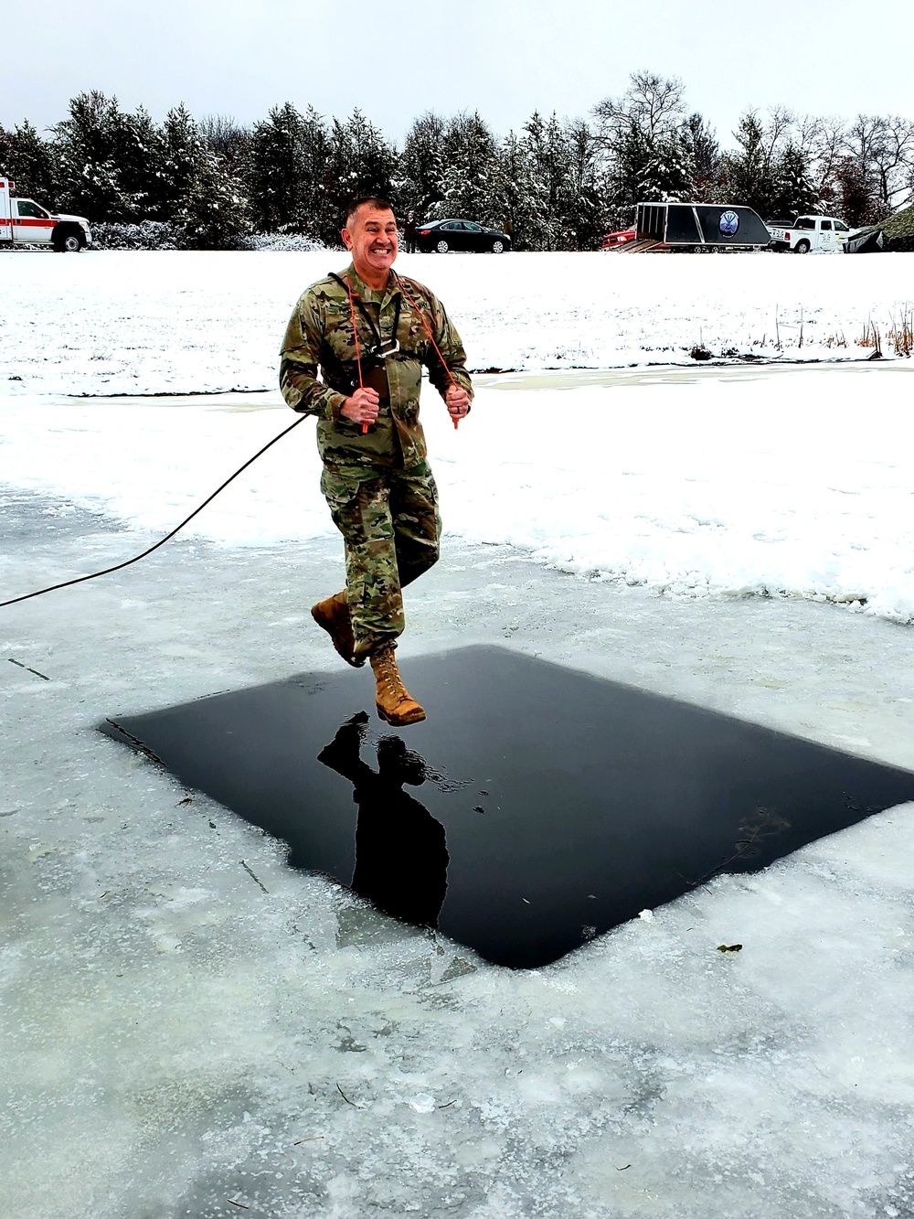 Fort McCoy garrison commander takes plunge during cold-water immersion familiarization