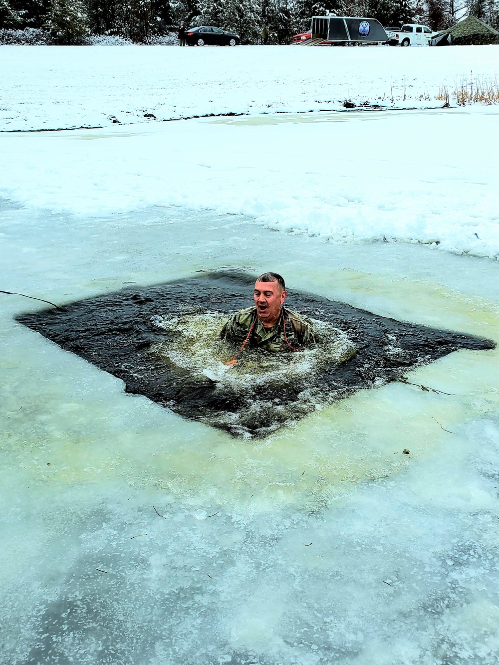 Fort McCoy garrison commander takes plunge during cold-water immersion familiarization