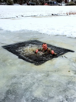 Fort McCoy garrison commander takes plunge during cold-water immersion familiarization