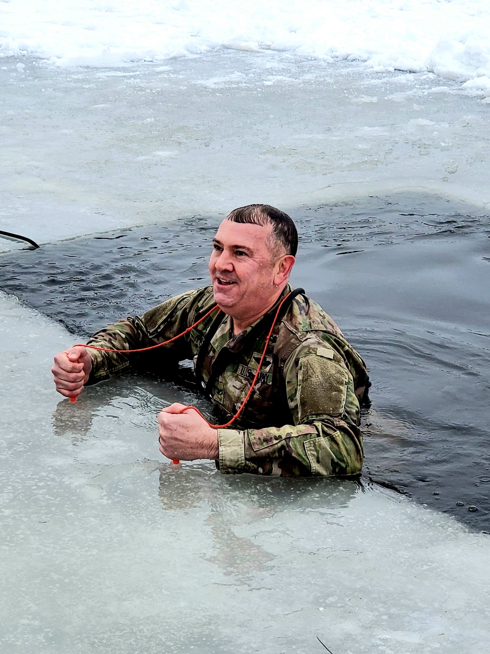 Fort McCoy garrison commander takes plunge during cold-water immersion familiarization