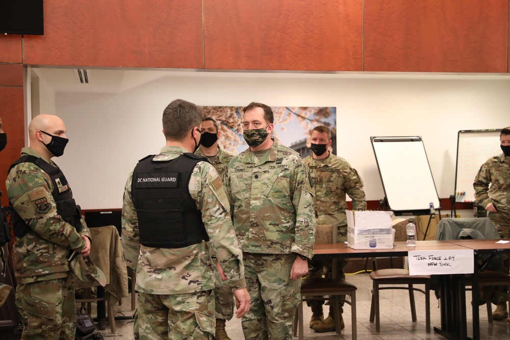 Brig. Gen. Maldonado talks with Lt. Col. Hunt with the New York National Guard.
