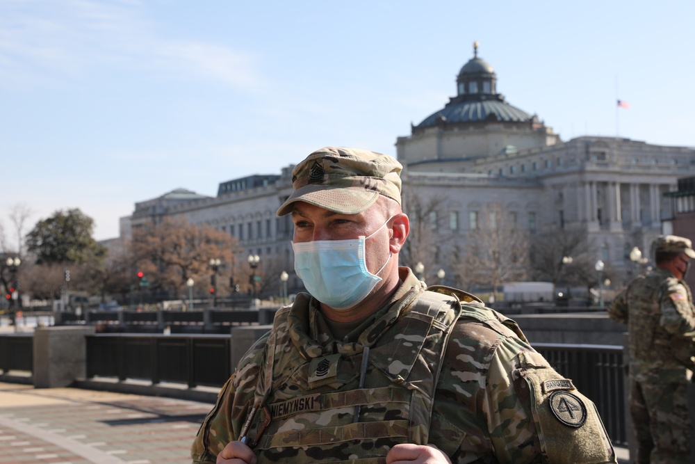 Command Sgt. Maj Niemynski stands near the U.S. Capitol building.