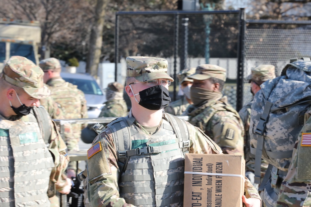 Soldiers with the Virginia National Guard arrive for their shift.