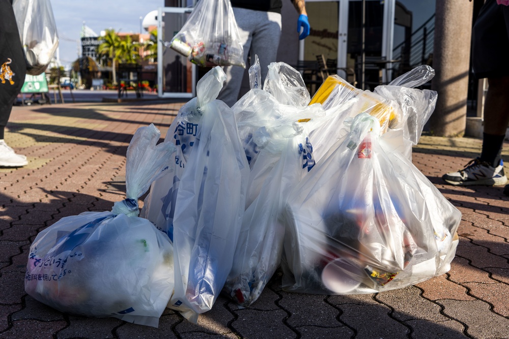 Members of the U.S. military community clean up American Village