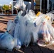 Members of the U.S. military community clean up American Village