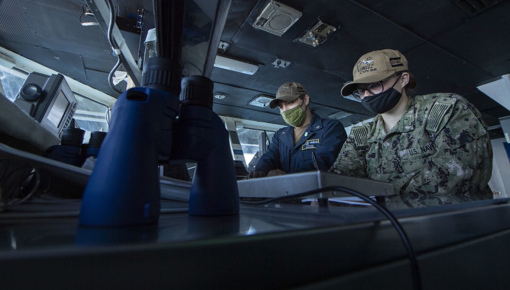 Sailors Track Ship's Log Aboard USS Nimitz