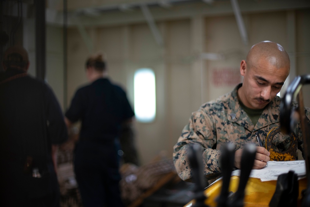 CAAT 1 Marines, Sailors load magazines for TRAP drill aboard USS San Diego