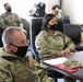 The New Jersey command team receives a mission brief on the Capitol support mission.