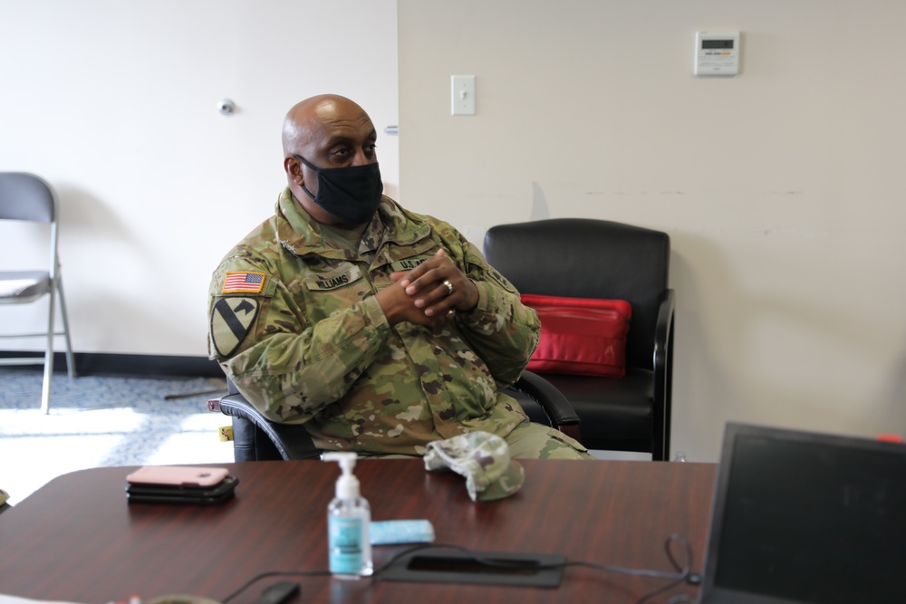 The New Jersey state command sergeant major receives a briefing on the mission to support the Capitol.