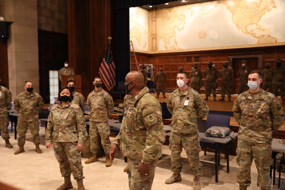 COl. Hou and Command Sgt. Maj. Williams speak with New Jersey Guardsmen near the Capitol.