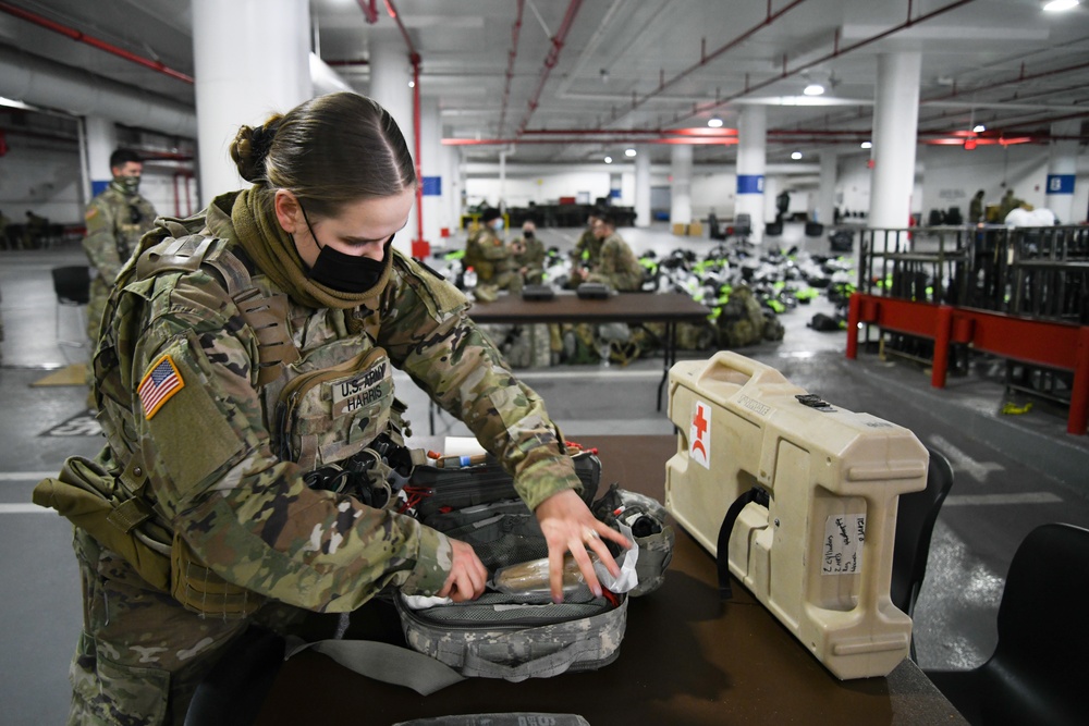 U.S. Army Spc. Cristen Harris, a combat medic specialist restocks her aid bag in Washington, D.C., Jan. 14, 2021