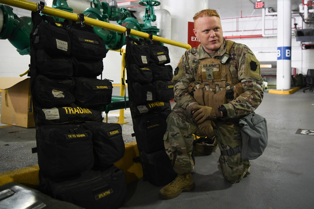 U.S. Army Staff Sgt. Elliott Smith, a combat medic specialist, describes his role during an emergency, in Washington, D.C., Jan. 12, 2021