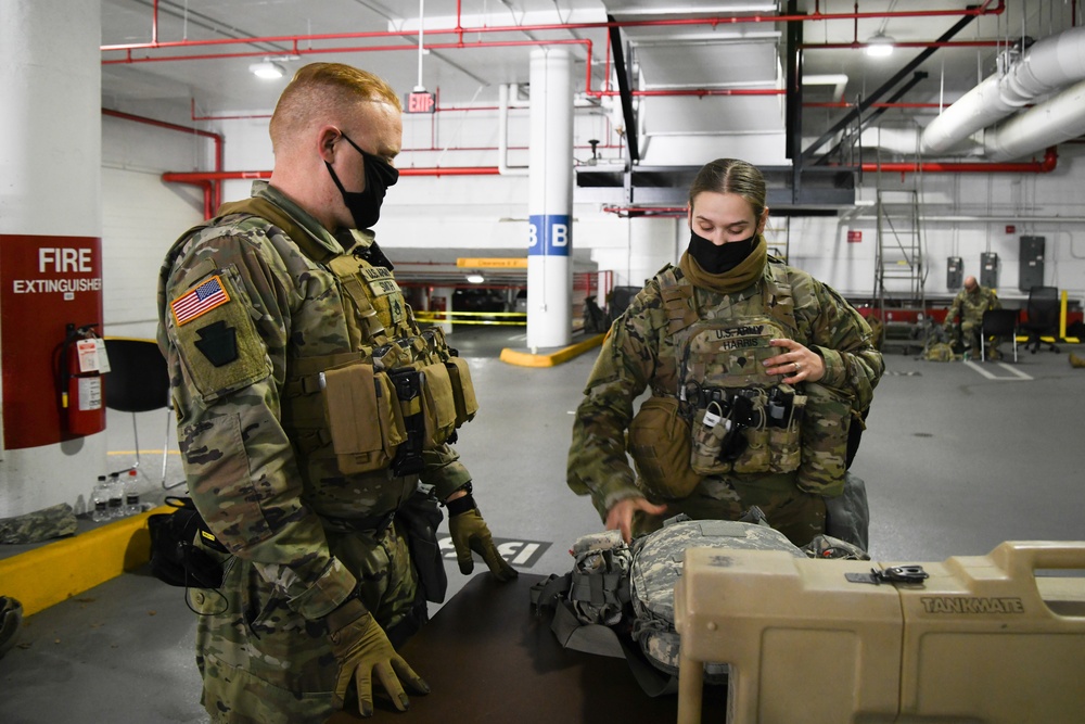 U.S. Army Spc. Cristen Harris, a combat medic specialist, prepares an aid bag, in Washington, D.C., Jan. 12, 2021