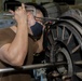 Nimitz Sailor Performs Maintenance on a Jet Engine