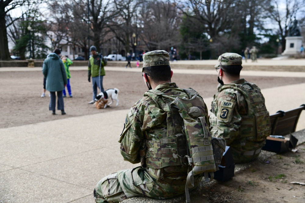 U.S. Army Pfc. Erick Salinas and Spc. Marcos Gonzalez take a lunch break at Lincoln Park in Washington, D.C., Jan. 18, 2021