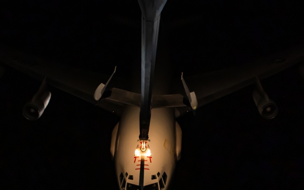 KC-10 provides fuel to E-3, F-15s