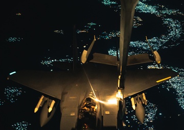 KC-10 provides fuel to E-3, F-15s