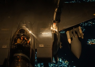 KC-10 provides fuel to E-3, F-15s