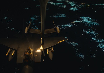 KC-10 provides fuel to E-3, F-15s