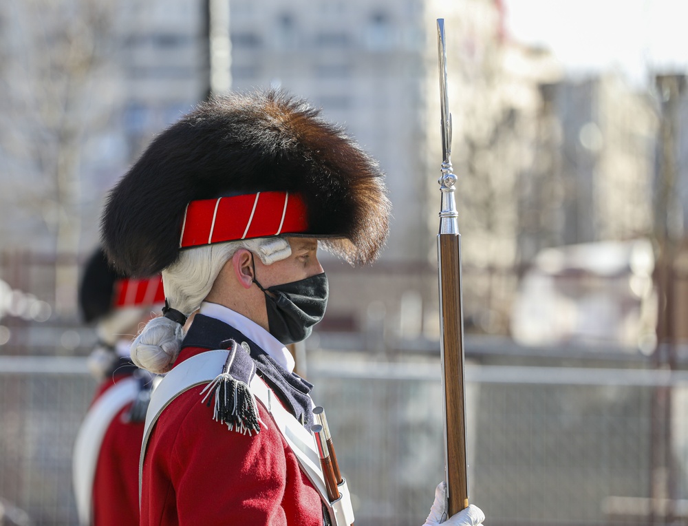 The U.S. Army Old Guard Fife and Drum Corps Soldiers stand in formation