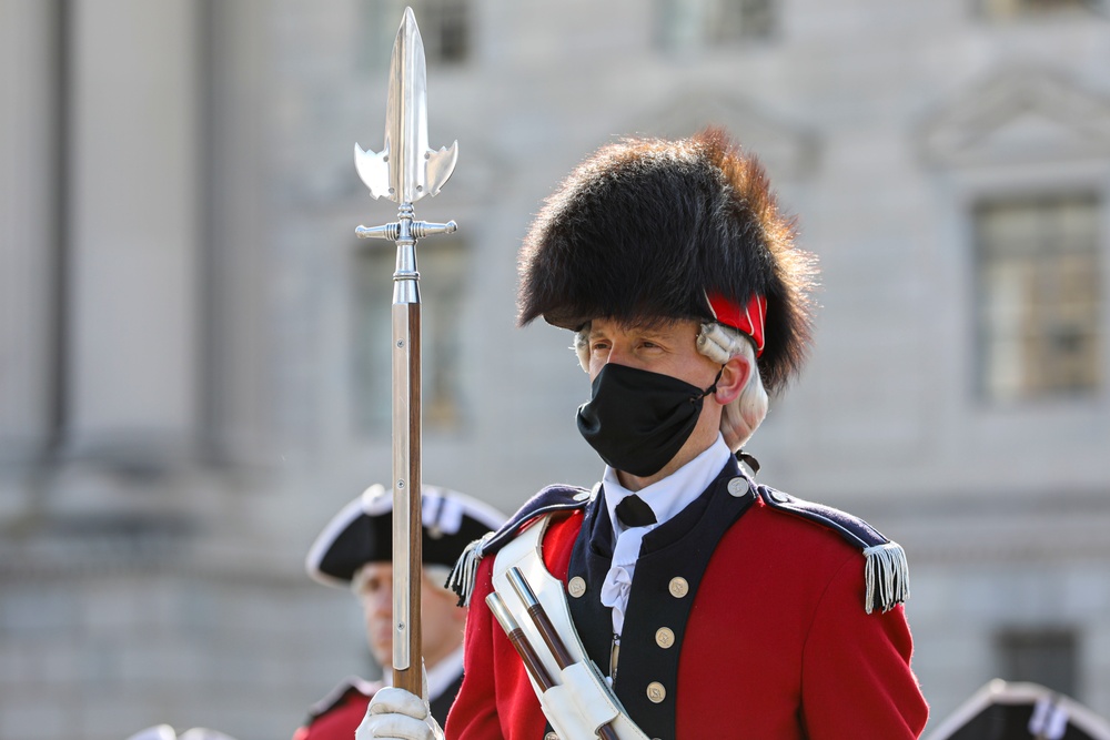The U.S. Army Old Guard Fife and Drum Corps Soldiers stand in formation