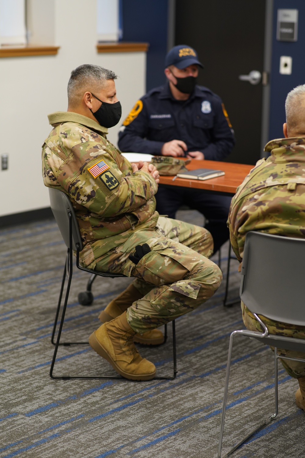 Hawaii National Guard Soldiers meet with Virginia State Police to finalize traffic security operations during the 59th Presidential Inauguration