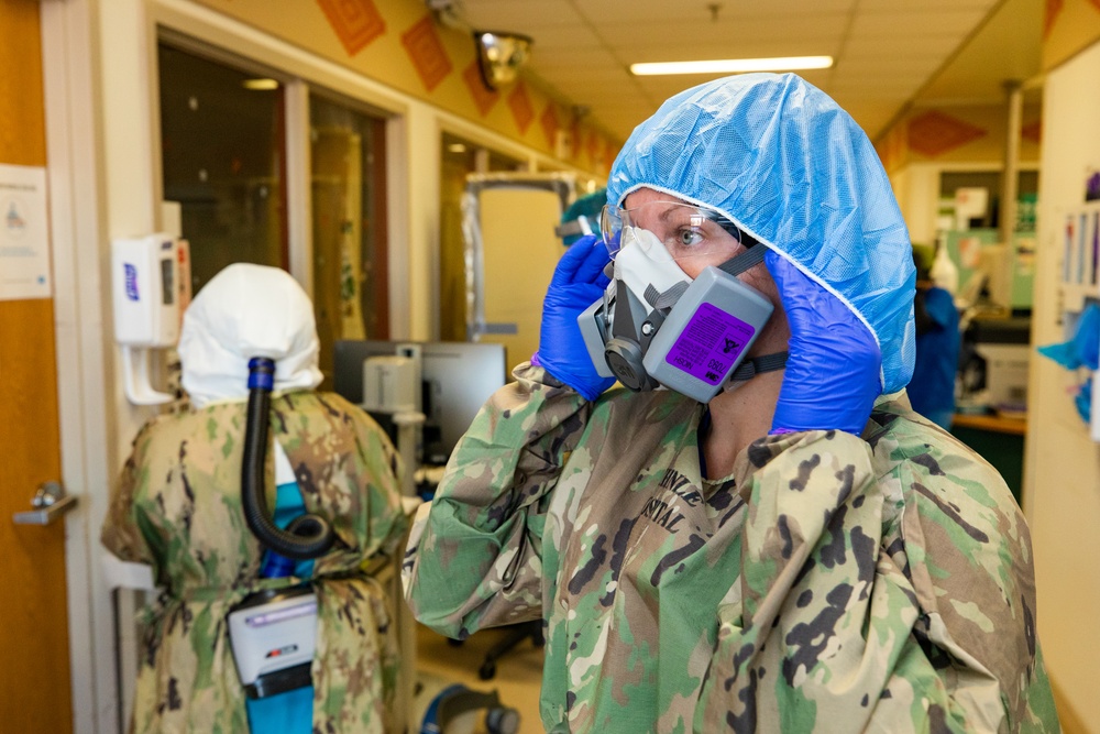 U.S. Navy Rapid Rural Response team works alongside Chinle Comprehensive Health Care Facility medical personnel