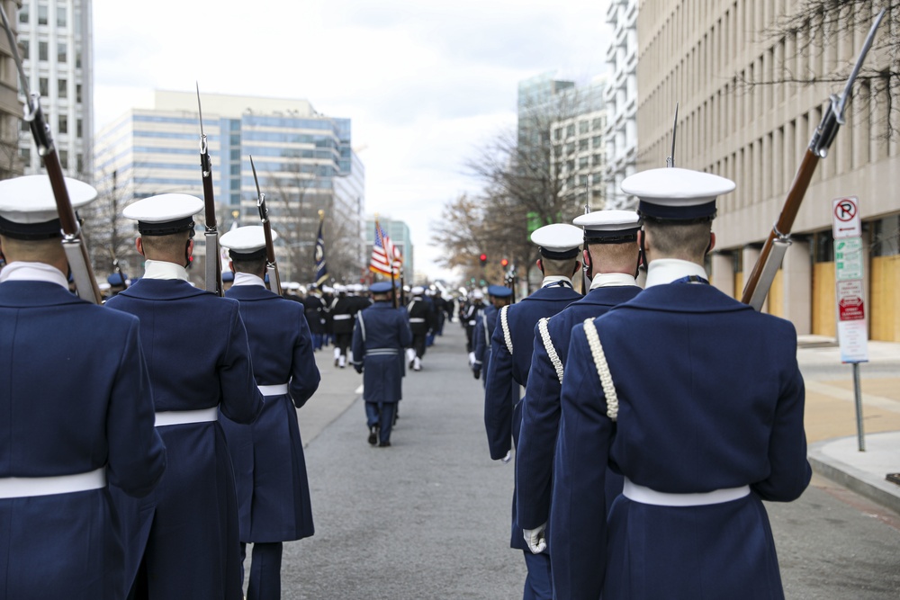 The U.S. Coast Guard Ceremonial Honor Guard stand in formation