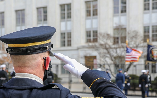 Members of the presidential escort salute the colors