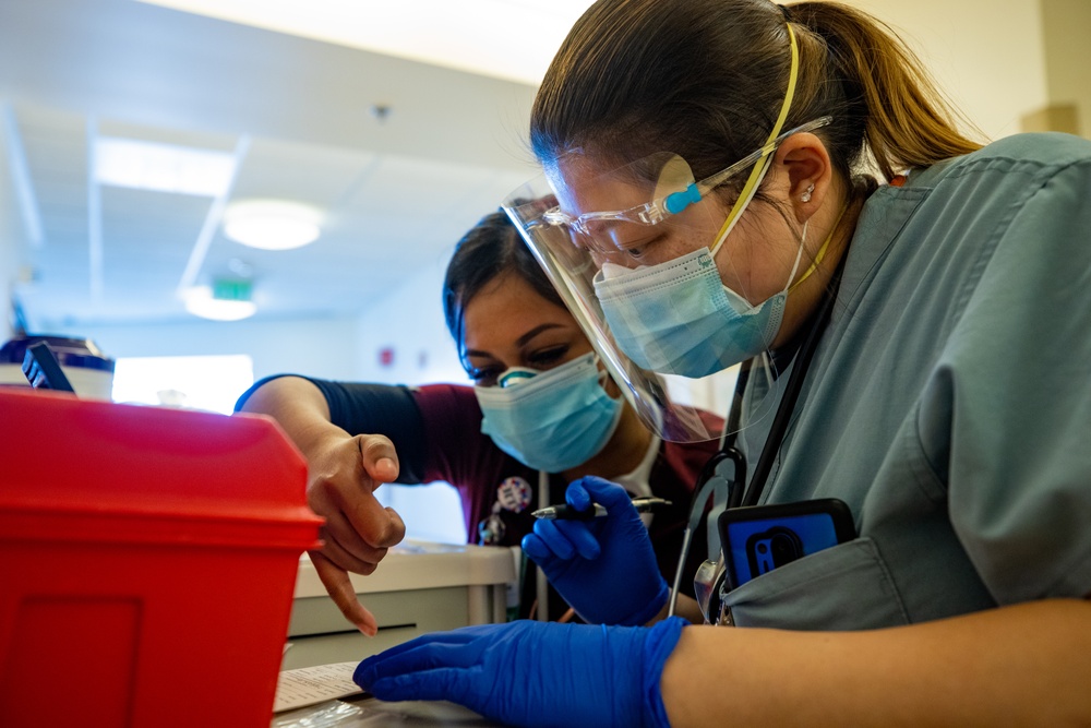 U.S. Air Force medical personnel work alongside Arrowhead Regional Medical Center providers