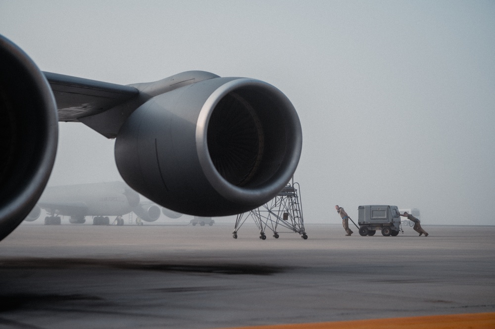 Fog rolls across the flighline at Al Udeid Air Base