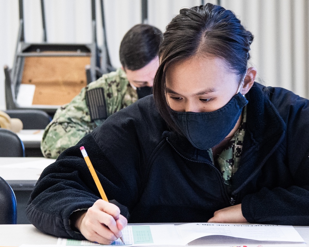 210119-N-TE695-0003 NEWPORT, R.I. (Jan. 19, 2021)  OTCN Sailors take E-7 advancement exam