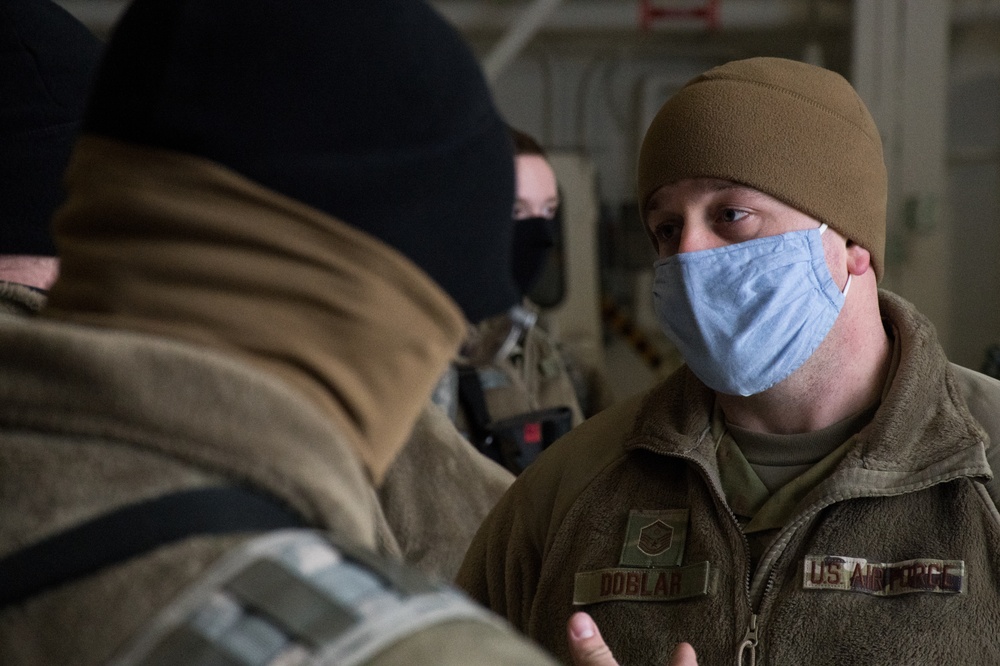 Airmen from the 133rd Airlift Wing prepare Soldiers from the 682nd Engineer Battalion to board a C-130 Hercules to Washington D.C.
