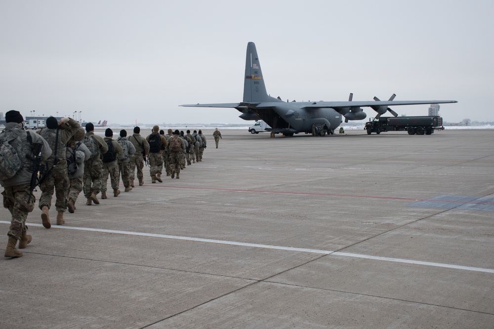 Soldiers from the 682nd board a C-130 Hercules at 133rd Airlift Wing to Washington D.C.