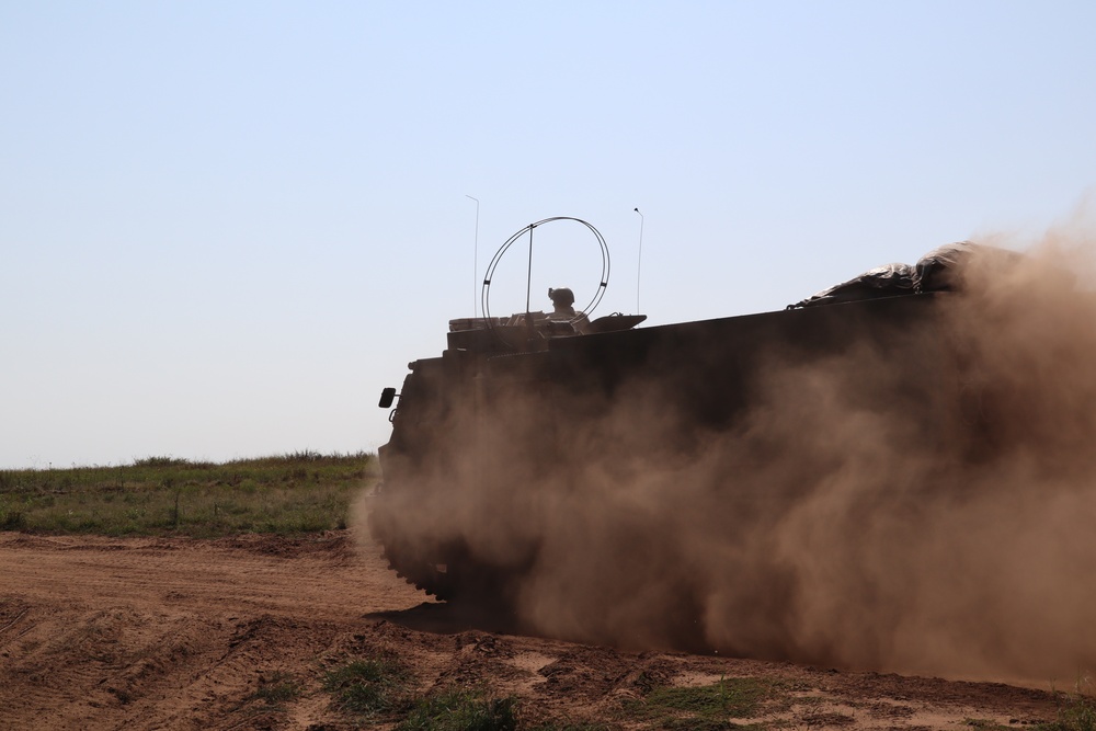 The M142 High Mobility Artillery Rocket System moves into firing position