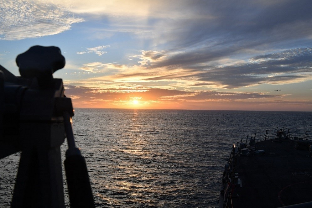 USS Freedom Underway at Sunset