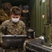 31st MEU Marine sets up high-frequency radio.