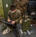 31st MEU Marine sets up high-frequency radio.